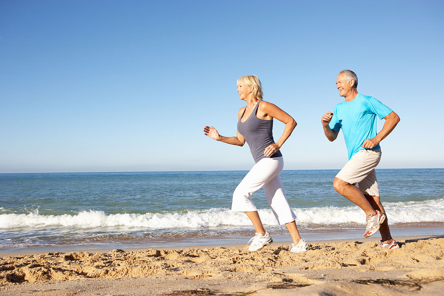 How Much HGH to Take a Day Older Couple Running on the Ocean Beach