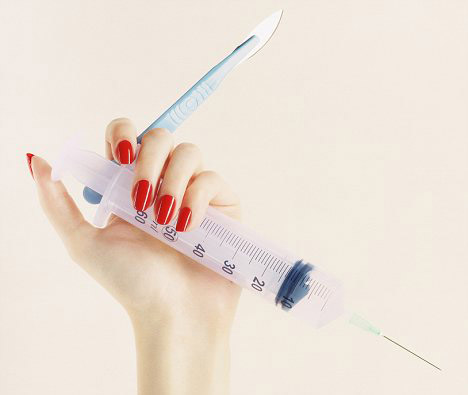 Sermorelin Dosage for Weight Loss Fingers with Red Nails Holding Syringe